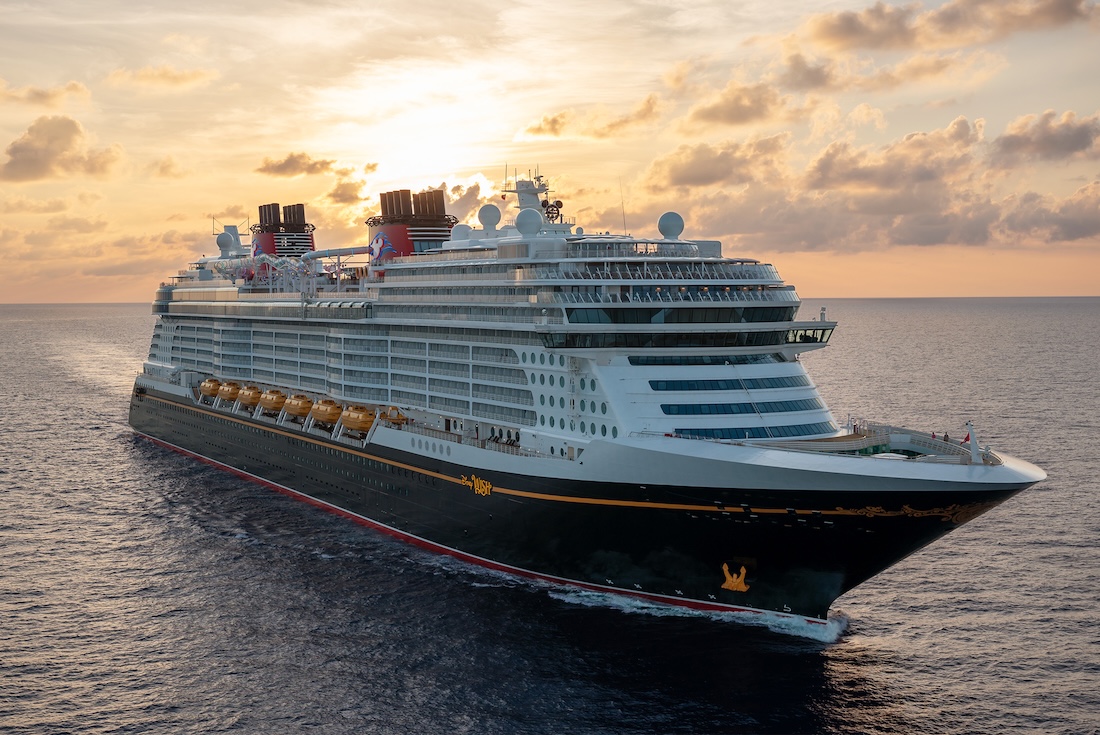 Disney Wish cruise ship sailing at sea with help from a Disney Cruise Line travel agent