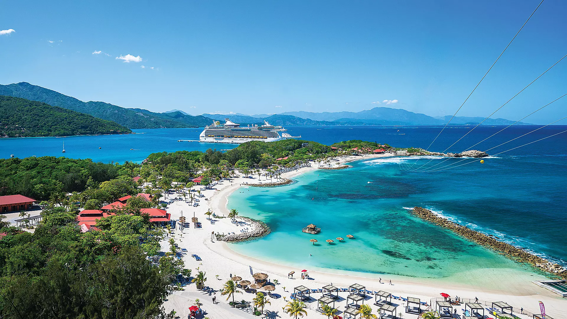 Royal Caribbean cruise ship at a tropical Caribbean beach destination
